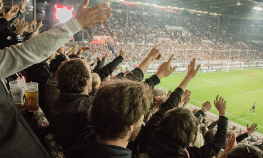 Where do commentators sit during a football match